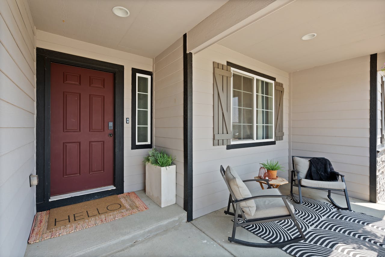 Spotless home exterior with clean windows, a polished front door, and a tidy porch in Orlando.